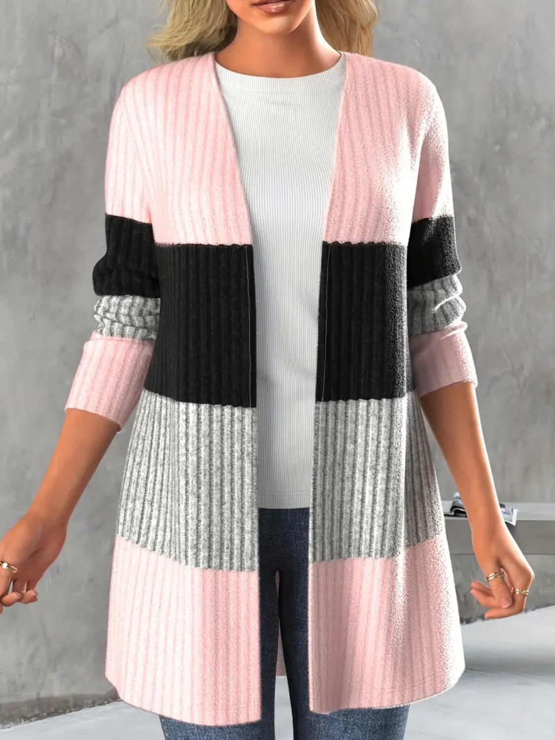 Monochrome block ribbed cardigan in pink, black, and grey stripes.