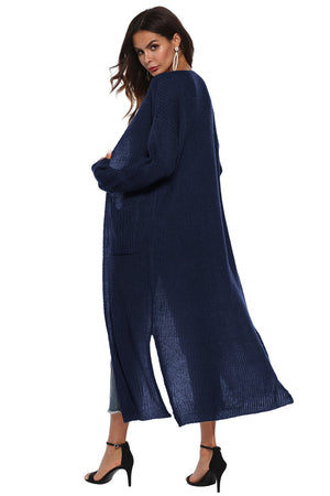 Longline knit cardigan in dark blue with side slits and pockets.