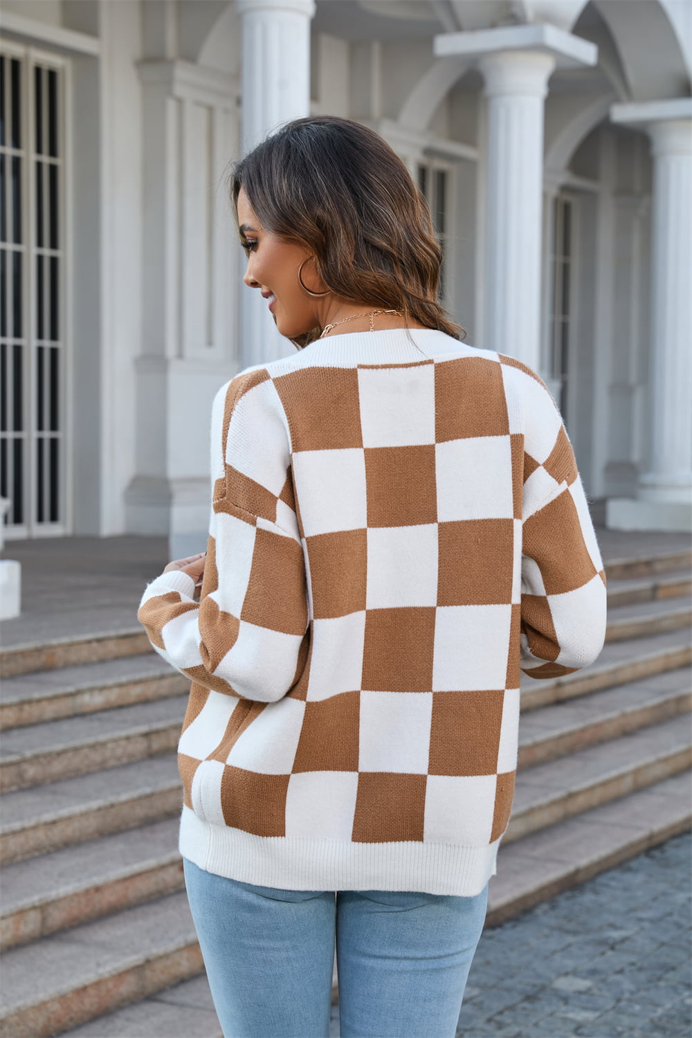 Checkerboard knit v-neck cardigan in caramel and white acrylic, relaxed fit.