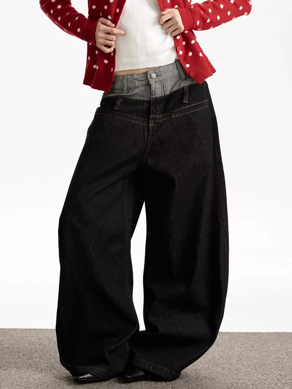 Layered double waist wide leg jeans in dark wash cotton with contrast grey denim overlay.