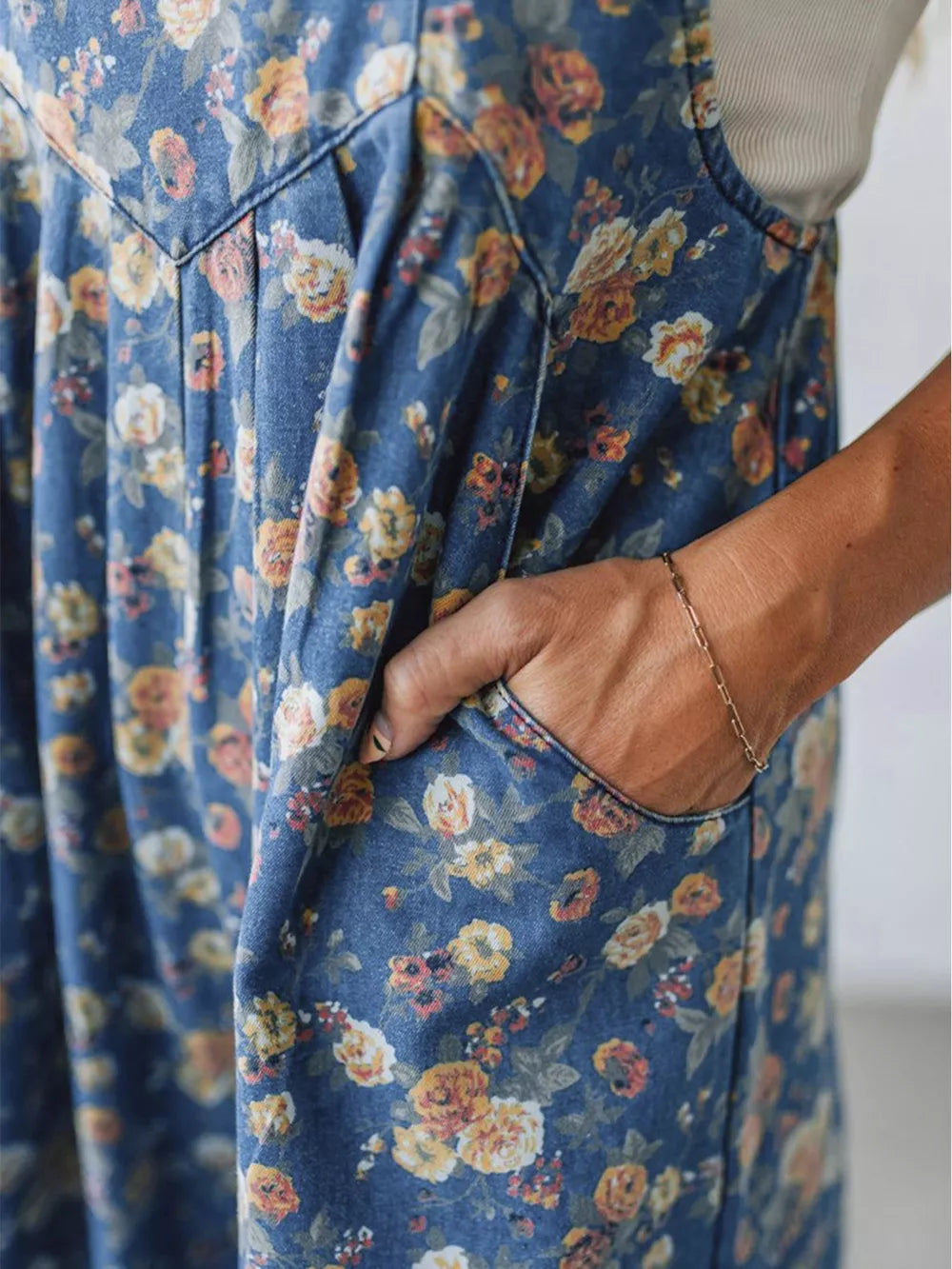 Floral denim overalls with adjustable straps and side pockets, women's casual style.