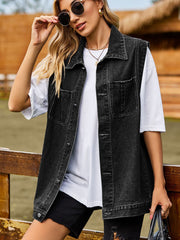 Sleeveless dark gray denim utility vest with button front and chest pockets.