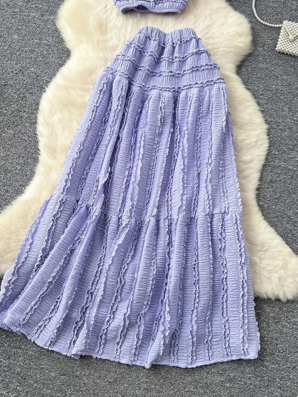 Purple ruched crop top and maxi skirt set with frill detail.