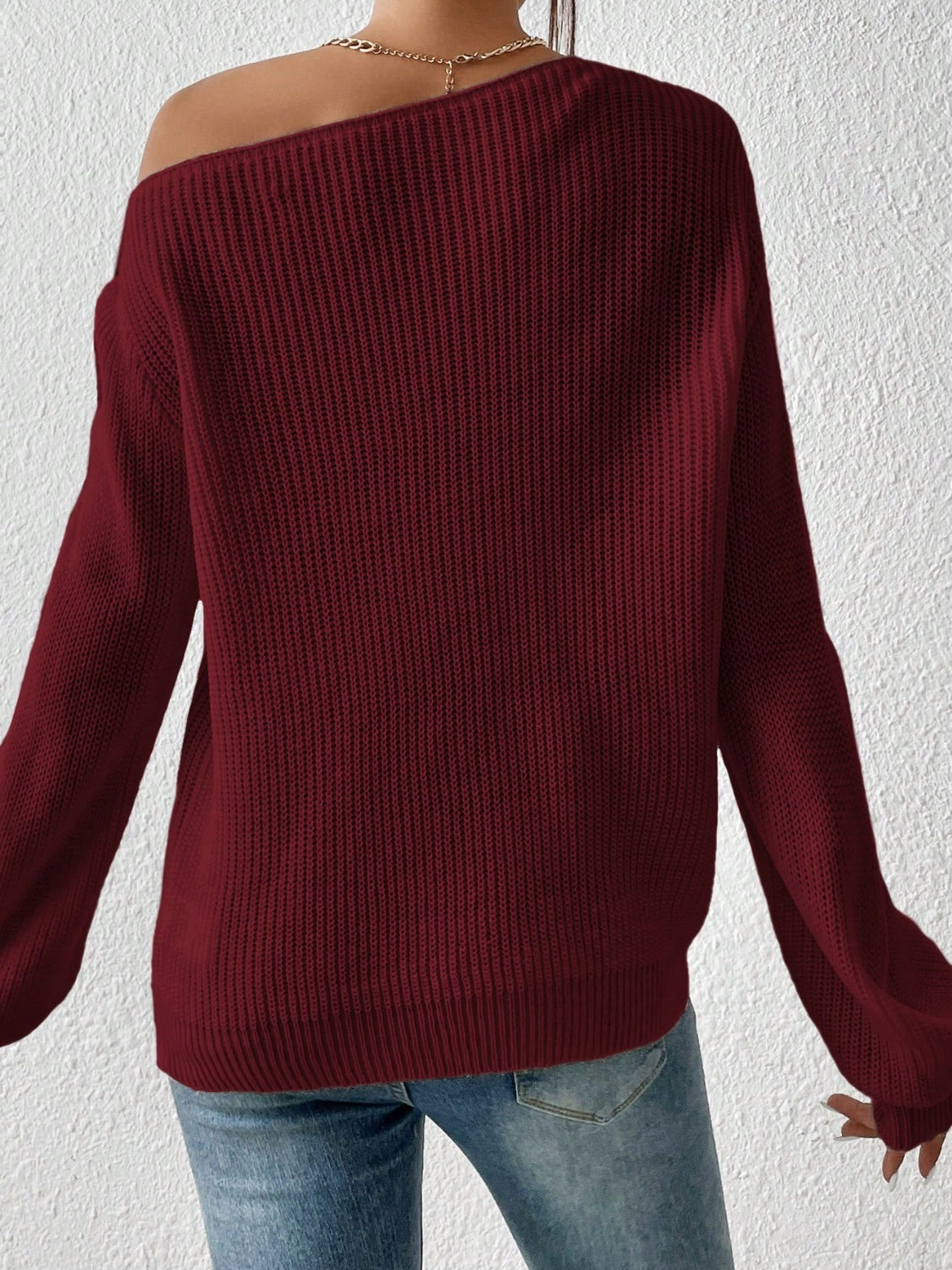 Burgundy ribbed knit off-shoulder top with balloon sleeves.