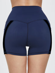 Dark blue activewear shorts with black side stripe detail and pocket.