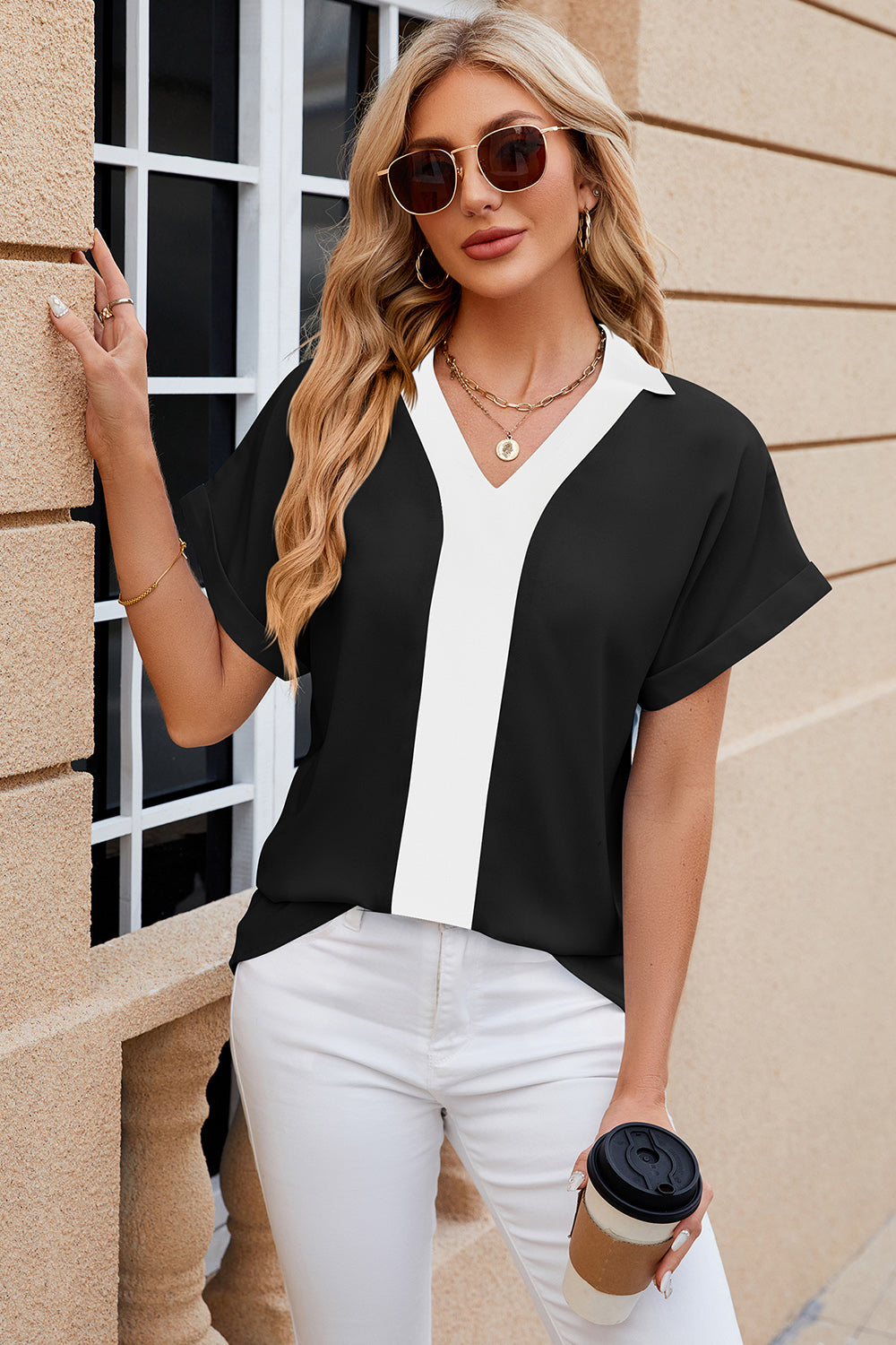 Black and white contrast panel v-neck blouson top with short cuffed sleeves.
