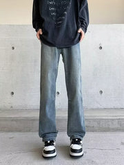 Men's light wash vintage wide-leg jeans with a relaxed fit.