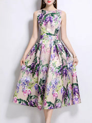 Wisteria floral print midi dress in blush pink with a-line cut and sleeveless design.