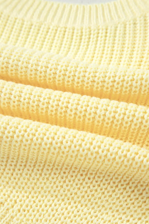 Yellow knit sweater vest with a textured stitch detail.