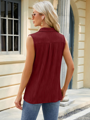 Burgundy textured collared sleeveless blouse with vertical ribbing detail.