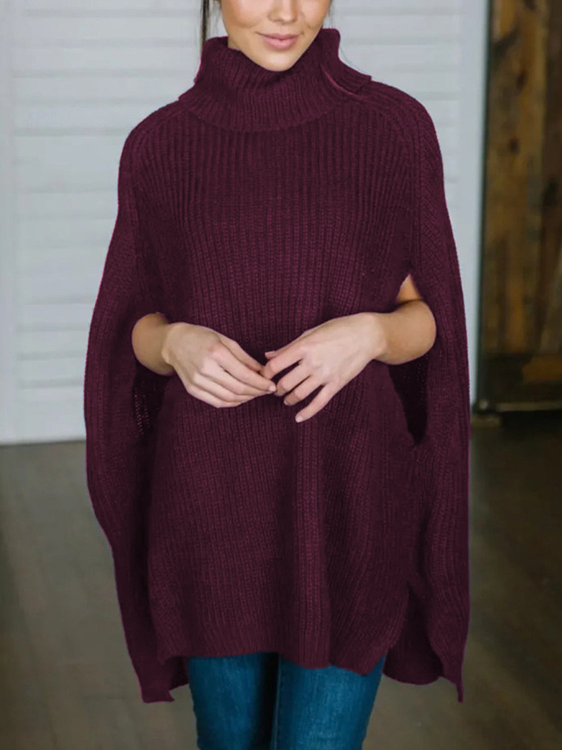 Deep Purple cape sleeve turtleneck knit sweater with ribbed texture and relaxed fit.
