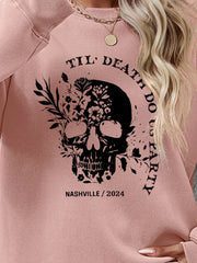 Blush Pink sweatshirt with floral skull graphic and text.