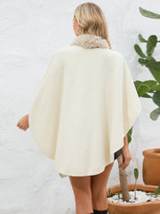 Cream faux fur collar wrap poncho with a relaxed fit.