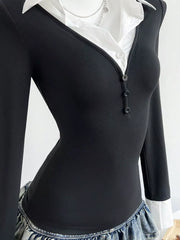 Black polo collar slim fit t-shirt with button detail and white collar peeking out.