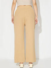 Tan wide leg trousers with a tailored seam front and buttoned detail.