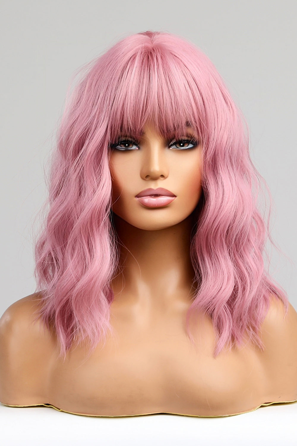 Pink bob wig with bangs and wavy texture