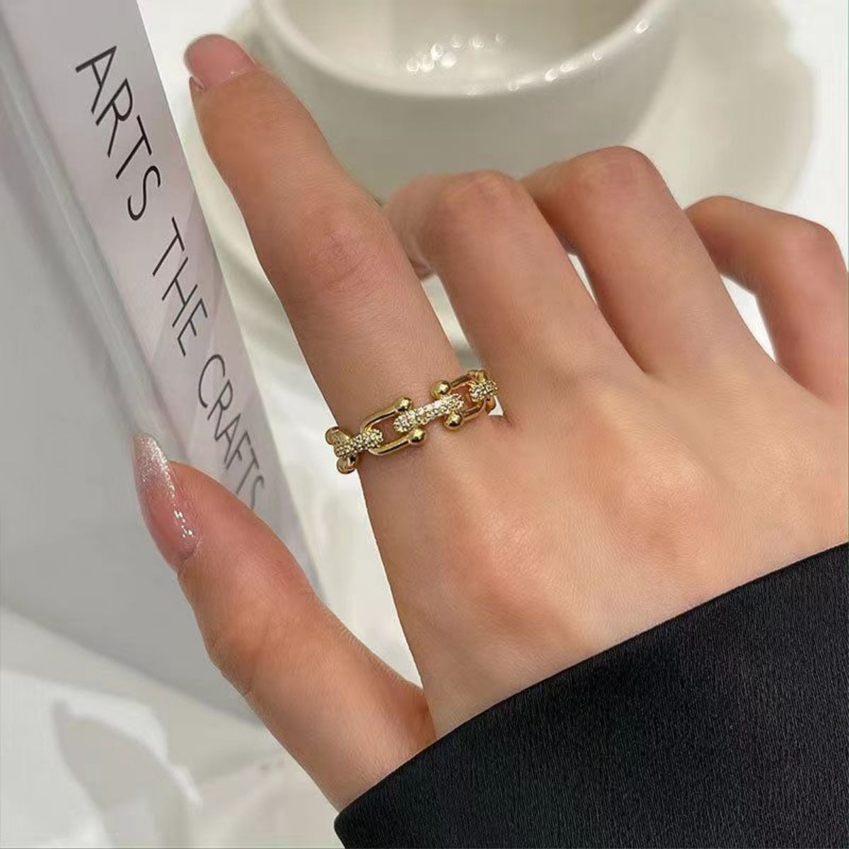 Gold color open chain-link ring with clear zircon accents.