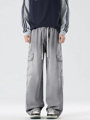 Light gray oversized cargo jeans with drawstring waist and large side pockets.