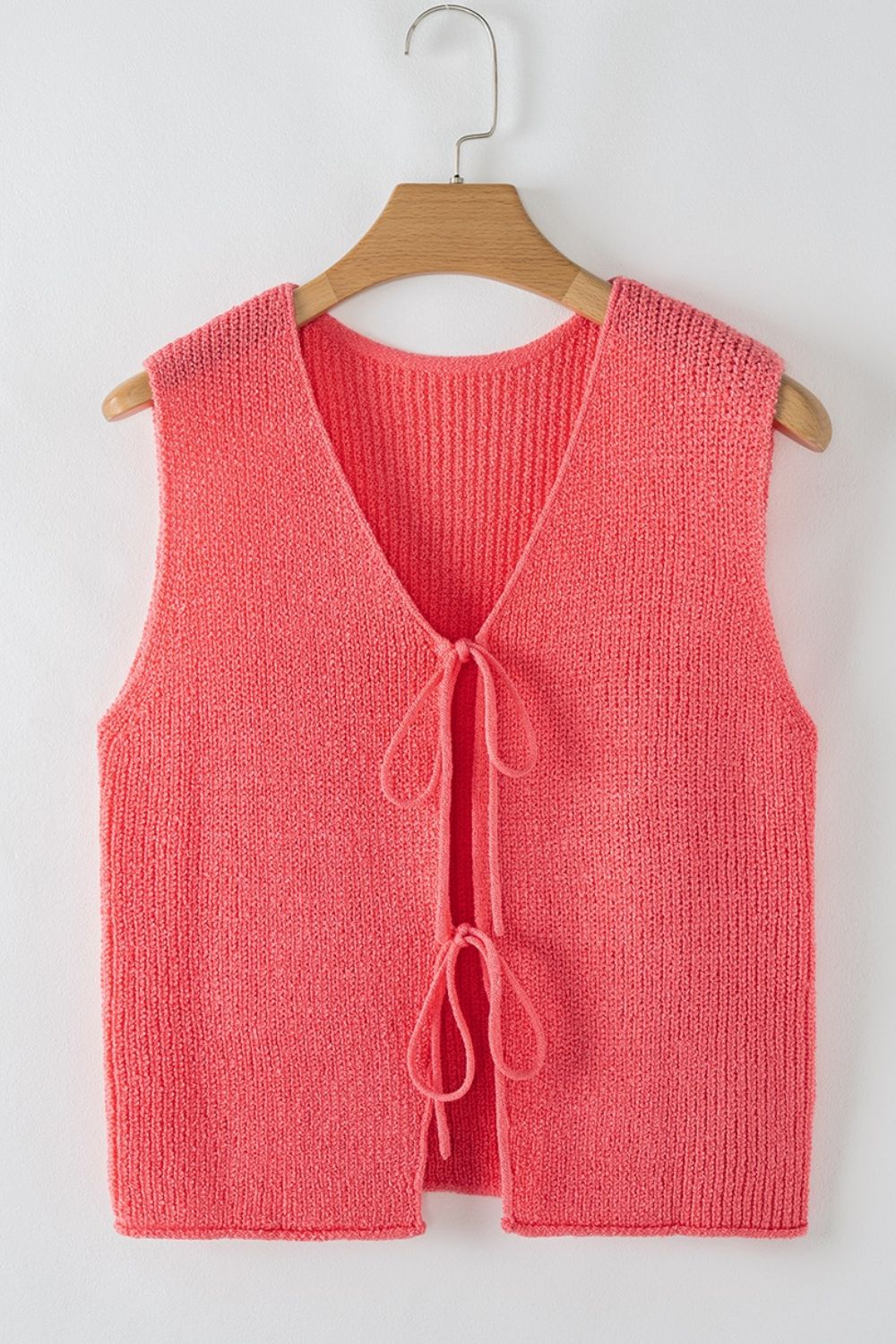 Burnt Coral textured knit tank top with V-neck and tie-front detail.