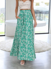 Green floral print palazzo trousers with pockets, cinched waist and wide leg