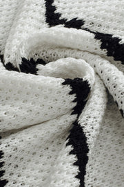 White and black stripe knit pullover sweater with open knit detail.