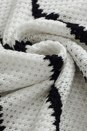 White and black stripe knit pullover sweater with open knit detail.