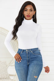 White long sleeve turtleneck bodysuit with a thong bottom, styled with high-waisted jeans.
