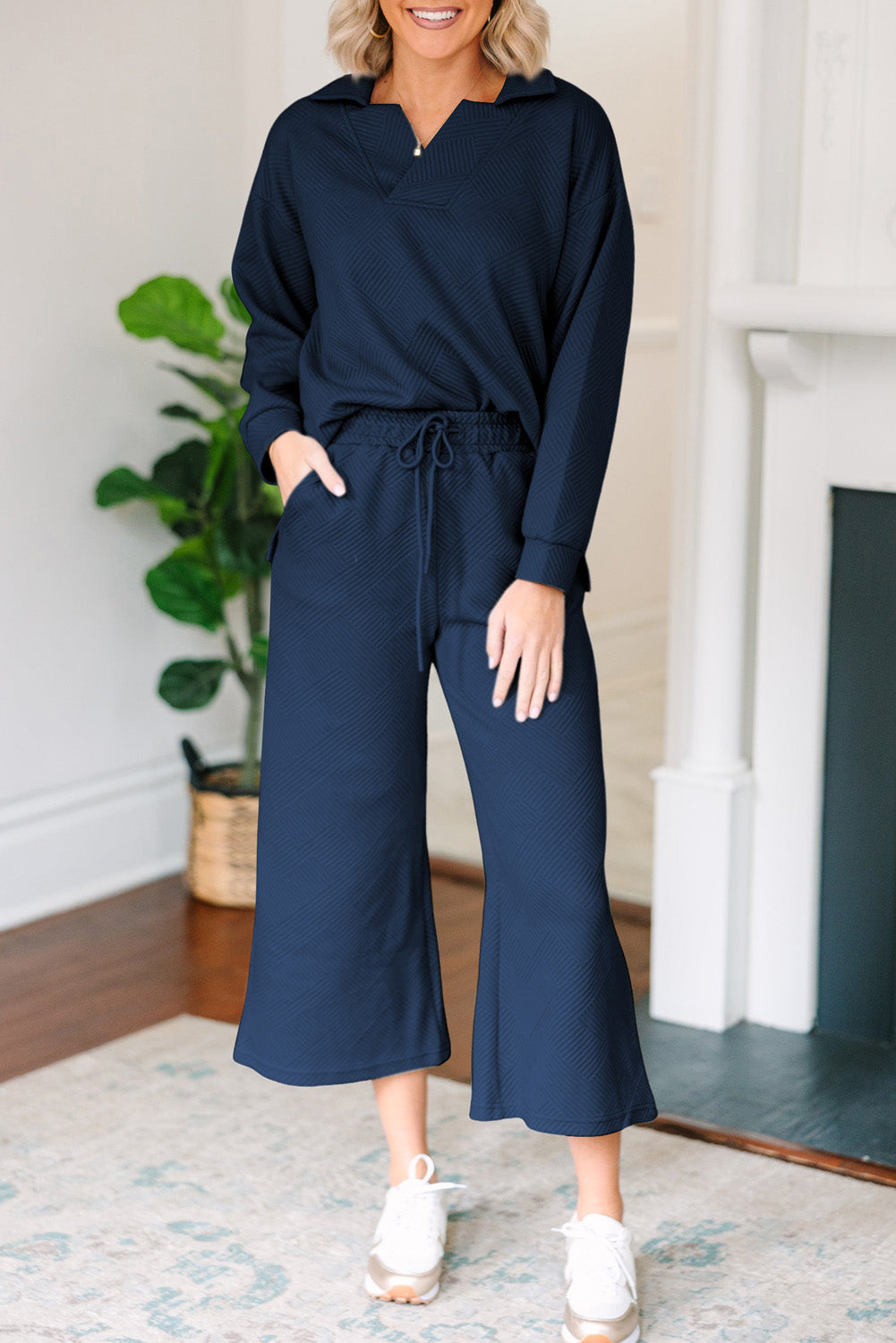 Navy textured polo set with wide-leg culottes and drawstring waist.