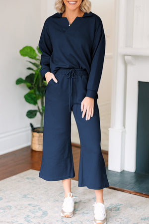 Navy textured polo set with wide-leg culottes and drawstring waist.
