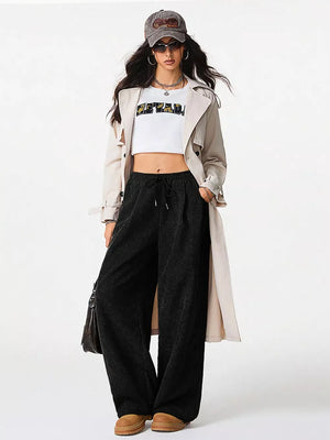 Relaxed fit corduroy wide-leg cargo maternity pants in black with drawstring waist.