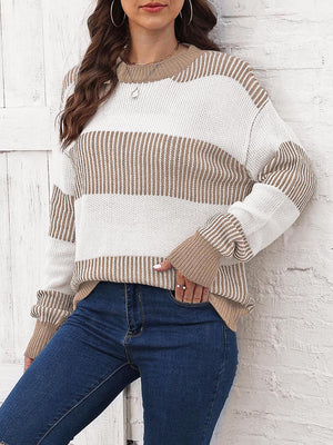 Striped knit crewneck sweater in khaki and white with ribbed trim and crew neckline.