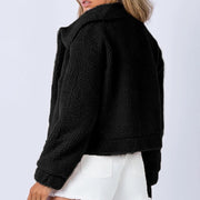 Black textured sherpa jacket with a cropped collar and relaxed fit.