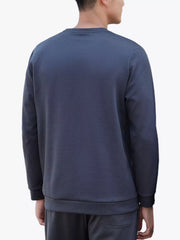 Men's crew neck sweatshirt in blue with textured fabric and long sleeves.
