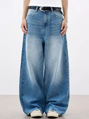 Relaxed fit vintage wash blue denim jeans with pockets and a baggy cut.
