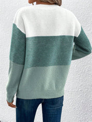 Colorblock boatneck knit sweater in white and green hues.