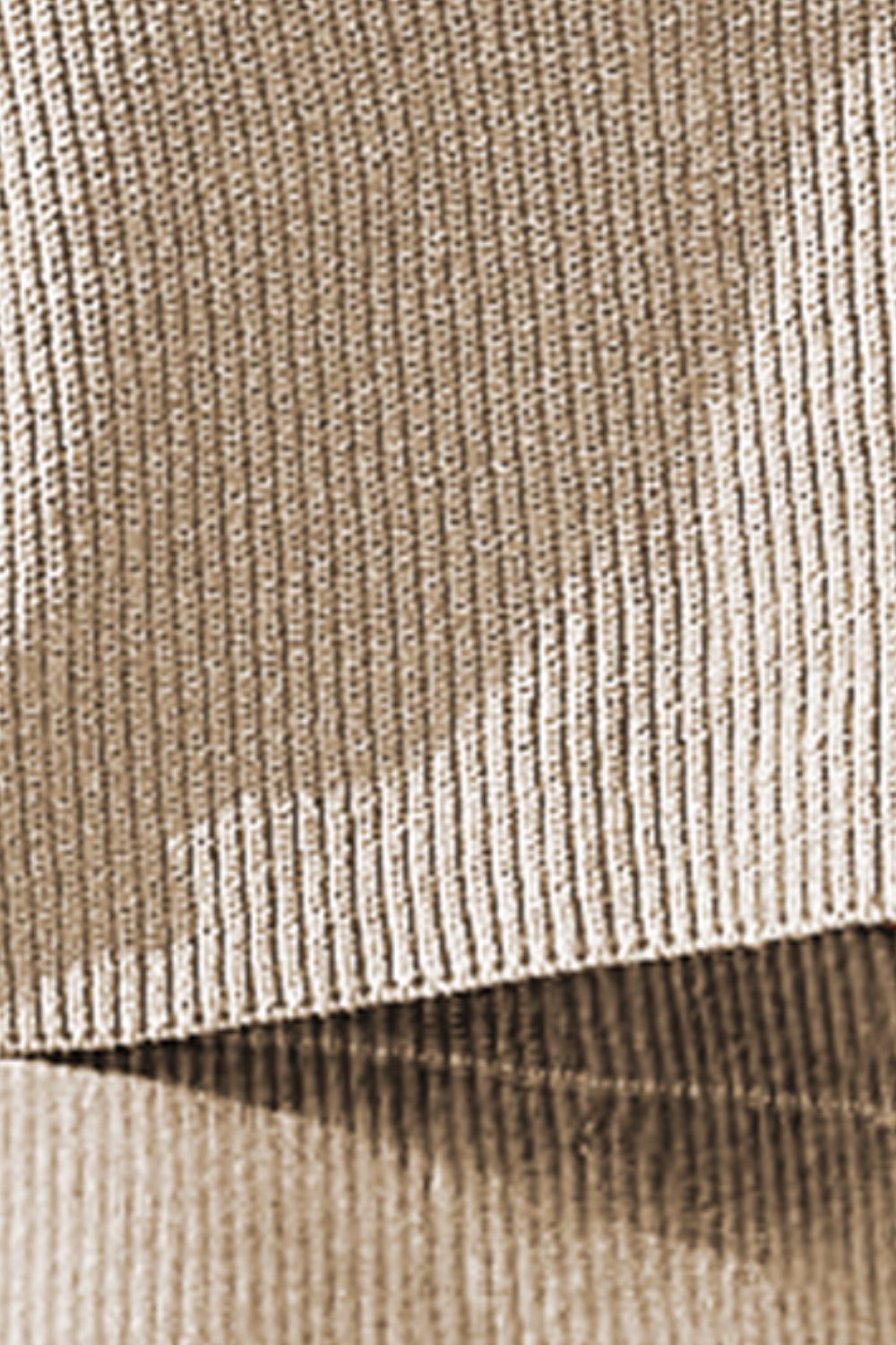 Textured knit top in khaki with a ribbed detail and pocket.