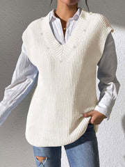 Ivory ribbed knit sleeveless V-neck vest with pearl embellishments, styled over a white shirt.