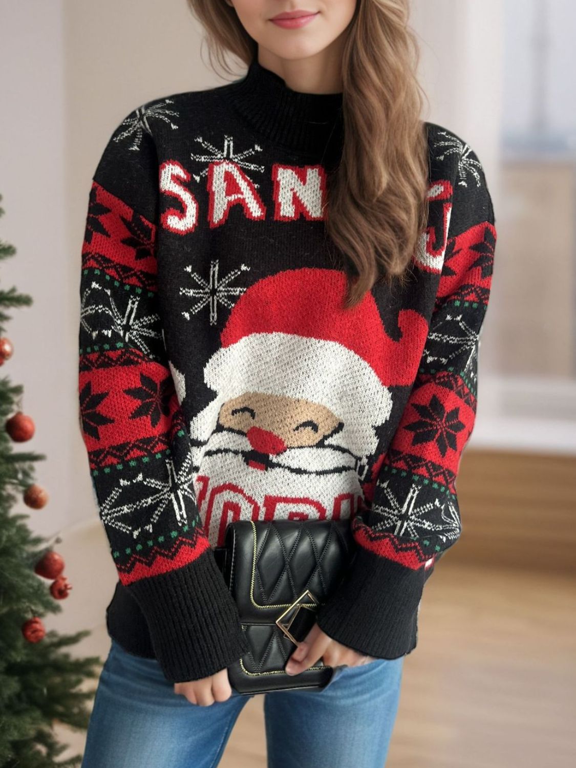 Black acrylic knit sweater with Santa graphic and snowflake pattern.