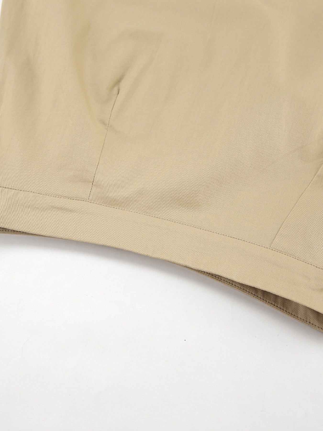 High-waisted A-line skirt in beige cotton with visible stitching detail.