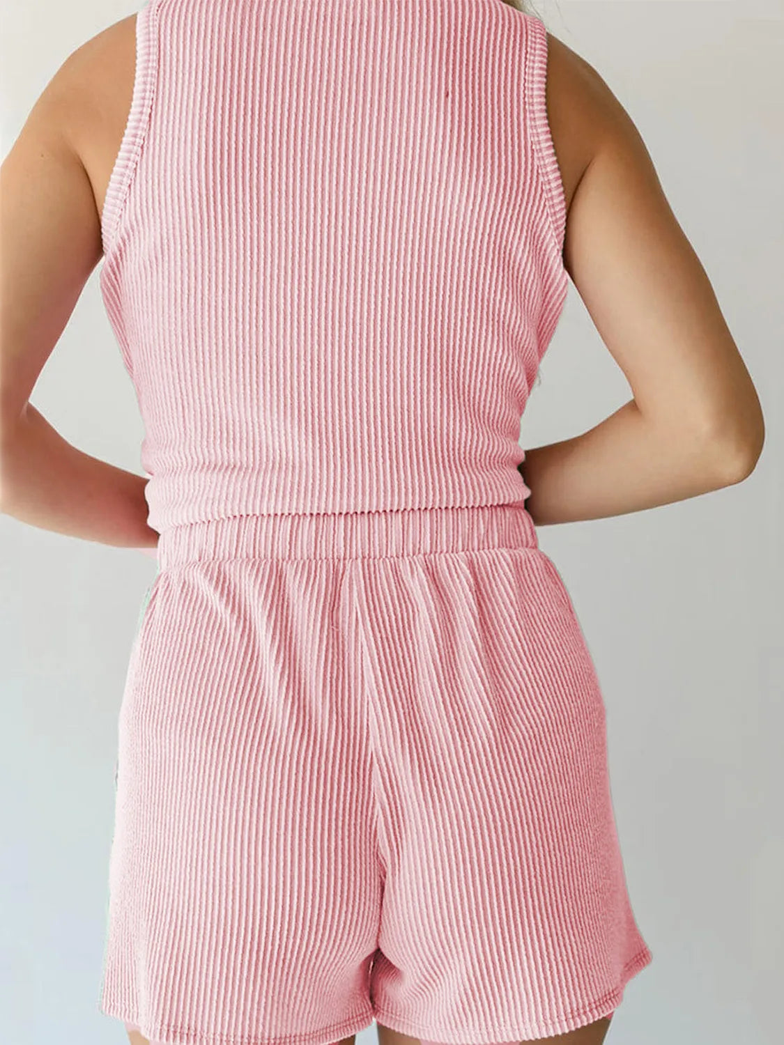 Blush pink ribbed sleeveless coord set with elastic waist shorts.