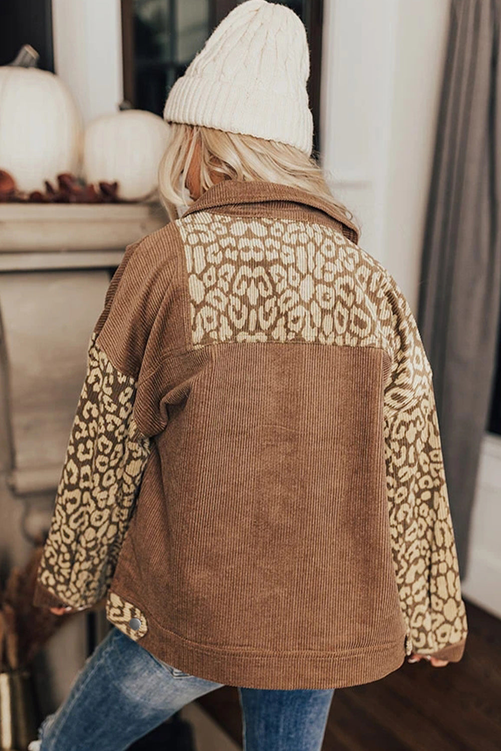 Camel corduroy jacket with leopard print panels on the back and sleeves.