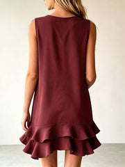 Burgundy tiered ruffle mini dress with a sleeveless, A-line cut.