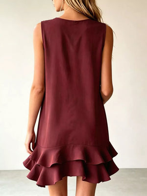 Burgundy tiered ruffle mini dress with a sleeveless, A-line cut.