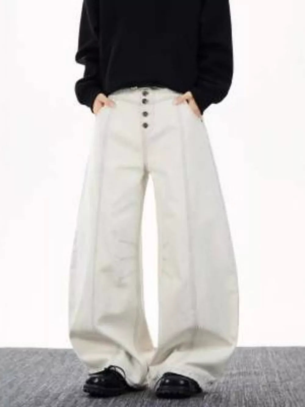 Relaxed fit wide leg button-fly jeans in cream cotton with contrast stitching.
