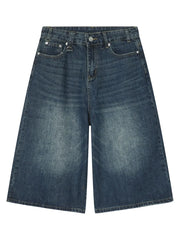 Wide-leg denim culottes in a faded blue wash with a relaxed fit.
