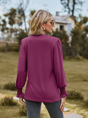 Fuchsia long sleeve blouse with pleated yoke and shirred cuffs.