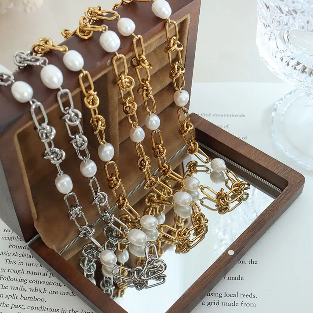 Linked pearl knot collar necklaces in gold and silver with white pearls.