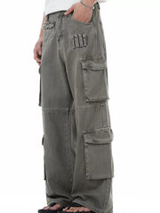 Men's grey distressed cargo pants with multiple utility pockets.