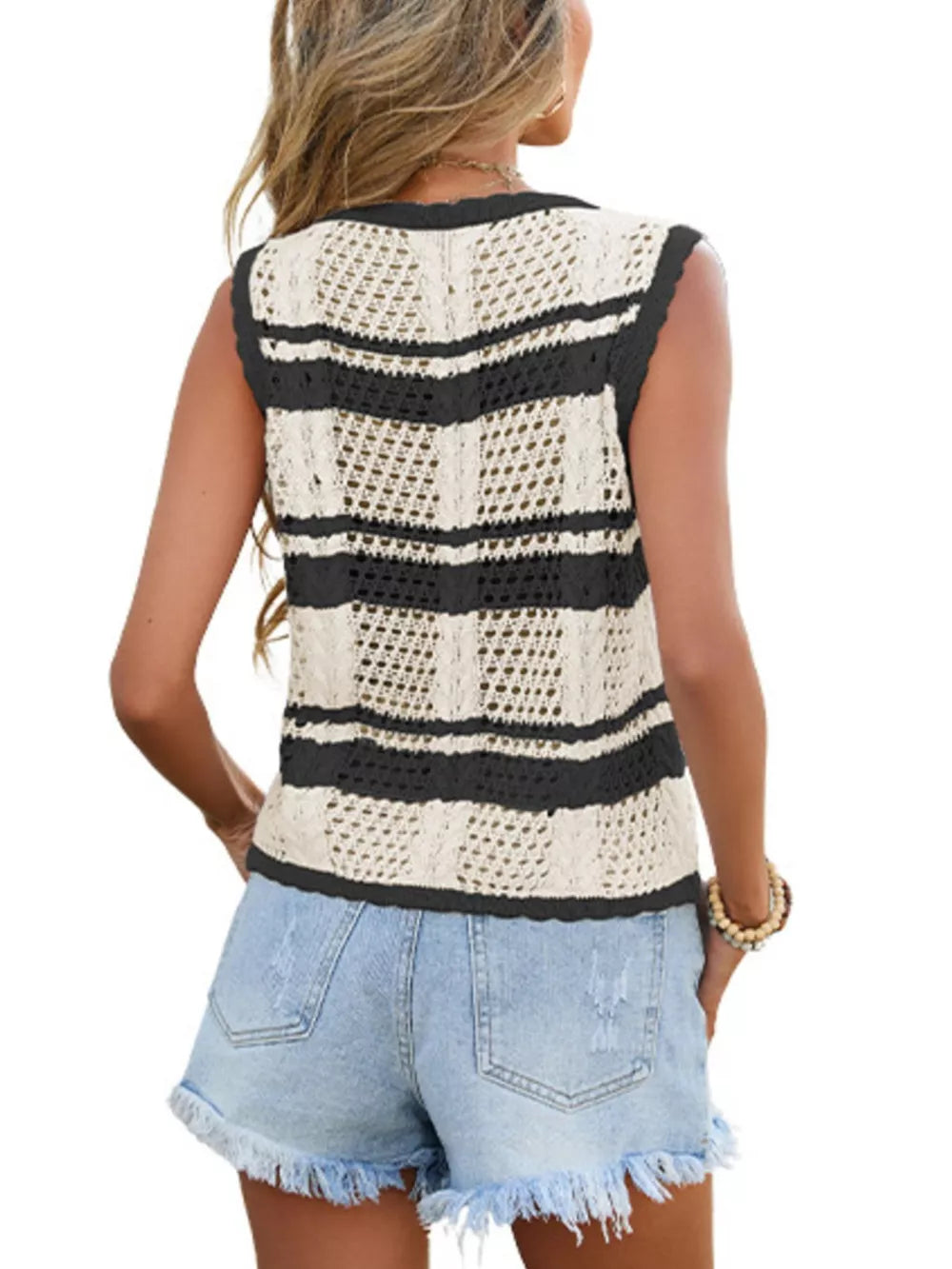Striped openwork crochet cardigan vest with black trim.