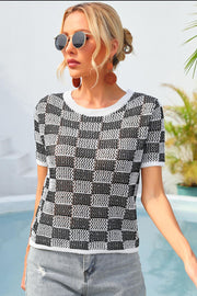 Checkerboard knit crewneck top with short sleeves in black and white.